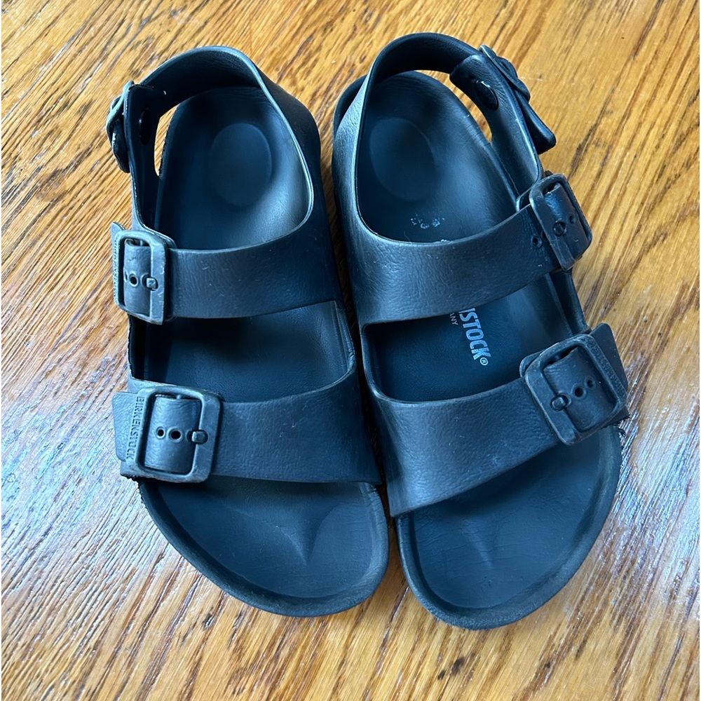 Birkenstock black rubber sandals. Buckles on toe and ankle strap. Size 3-3.5